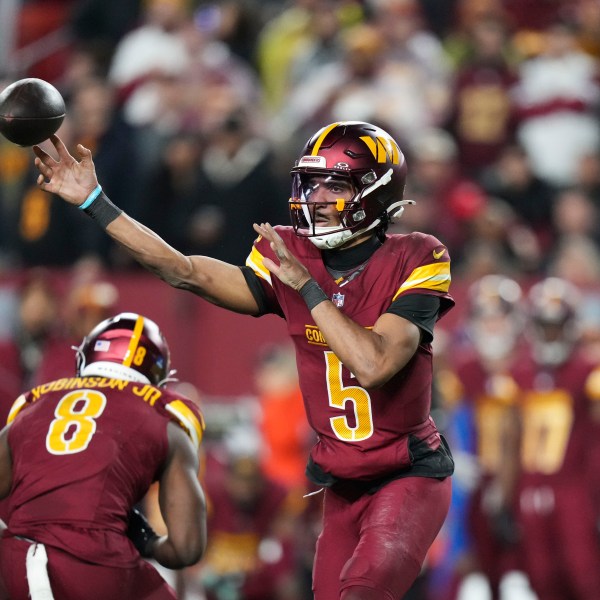 Washington Commanders quarterback Jayden Daniels (5) passes during the second half of an NFL football game, against the Atlanta Falcons Sunday, Dec. 29, 2024, in Landover, Md. (AP Photo/Stephanie Scarbrough)