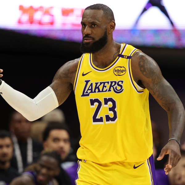 Los Angeles Lakers forward LeBron James (23) celebrates after scoring against the Sacramento Kings during the second half of an NBA basketball game in Sacramento, Calif., Thursday, Dec. 19, 2024. (AP Photo/Jed Jacobsohn)