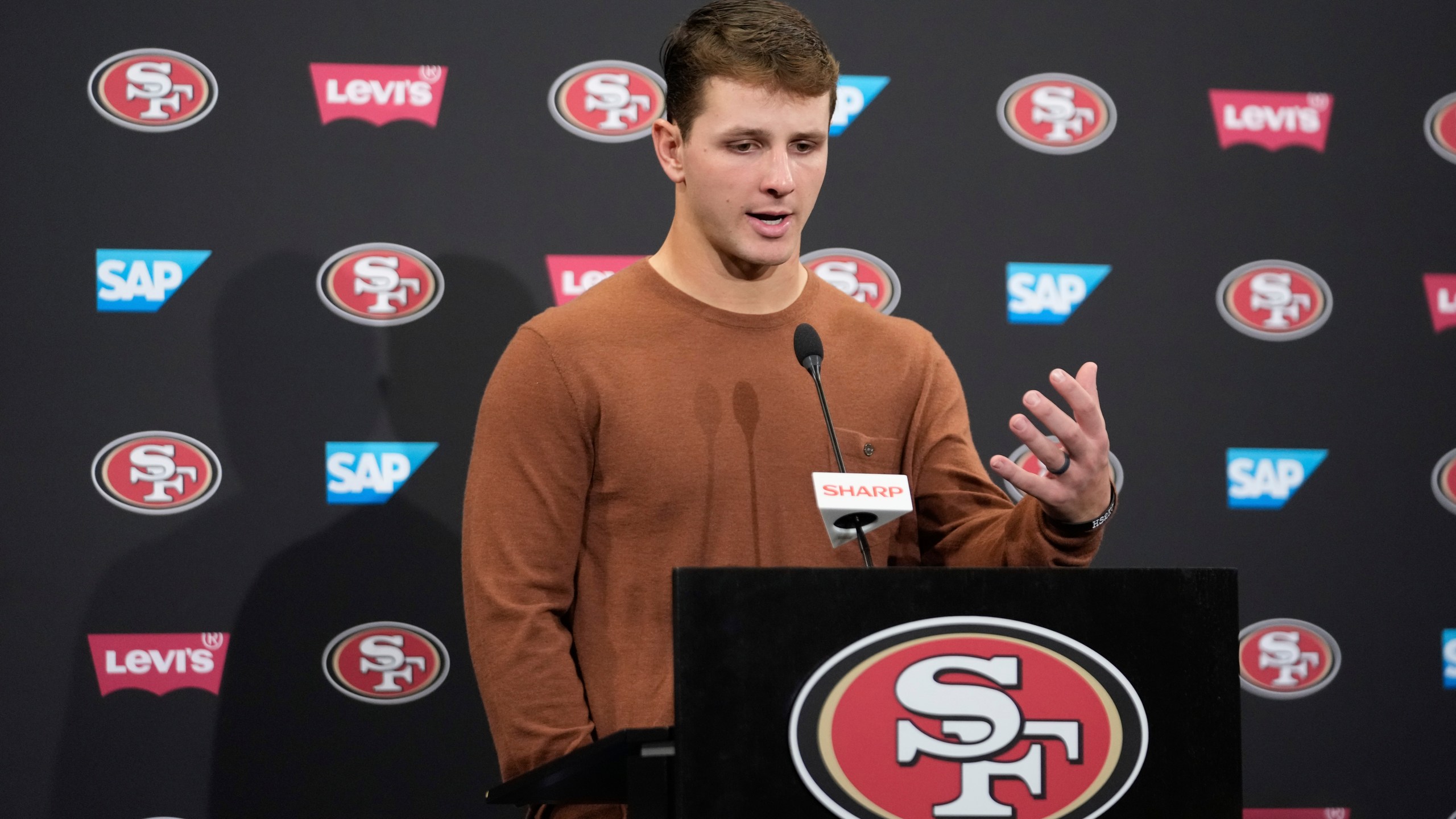 San Francisco 49ers quarterback Brock Purdy answers questions after an NFL football game against the Detroit Lions Monday, Dec. 30, 2024, in Santa Clara, Calif. (AP Photo/Godofredo A. Vásquez)