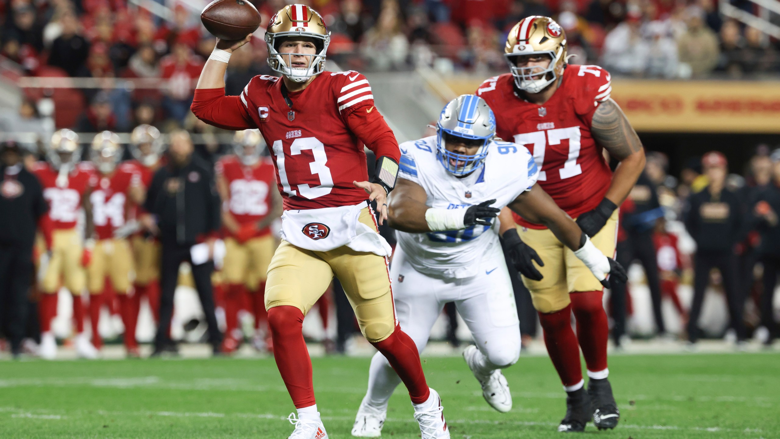 San Francisco 49ers quarterback Brock Purdy (13) runs for a touchdown during the first half of an NFL football game against the Detroit Lions, Monday, Dec. 30, 2024, in Santa Clara, Calif. (AP Photo/Jed Jacobsohn)