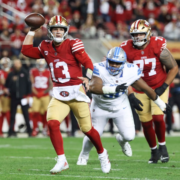 San Francisco 49ers quarterback Brock Purdy (13) runs for a touchdown during the first half of an NFL football game against the Detroit Lions, Monday, Dec. 30, 2024, in Santa Clara, Calif. (AP Photo/Jed Jacobsohn)