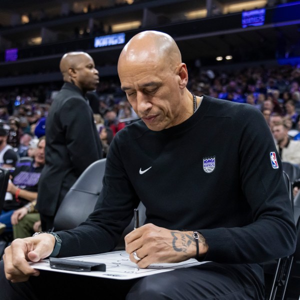 Sacramento Kings Interim Head Coach Doug Christie draws out a play before an NBA basketball game against the Dallas Mavericks Monday, Dec. 30, 2024, in Sacramento, Calif. (AP Photo/Sara Nevis)