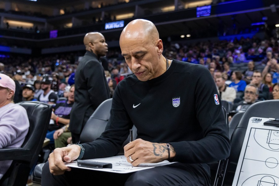 Sacramento Kings Interim Head Coach Doug Christie draws out a play before an NBA basketball game against the Dallas Mavericks Monday, Dec. 30, 2024, in Sacramento, Calif. (AP Photo/Sara Nevis)