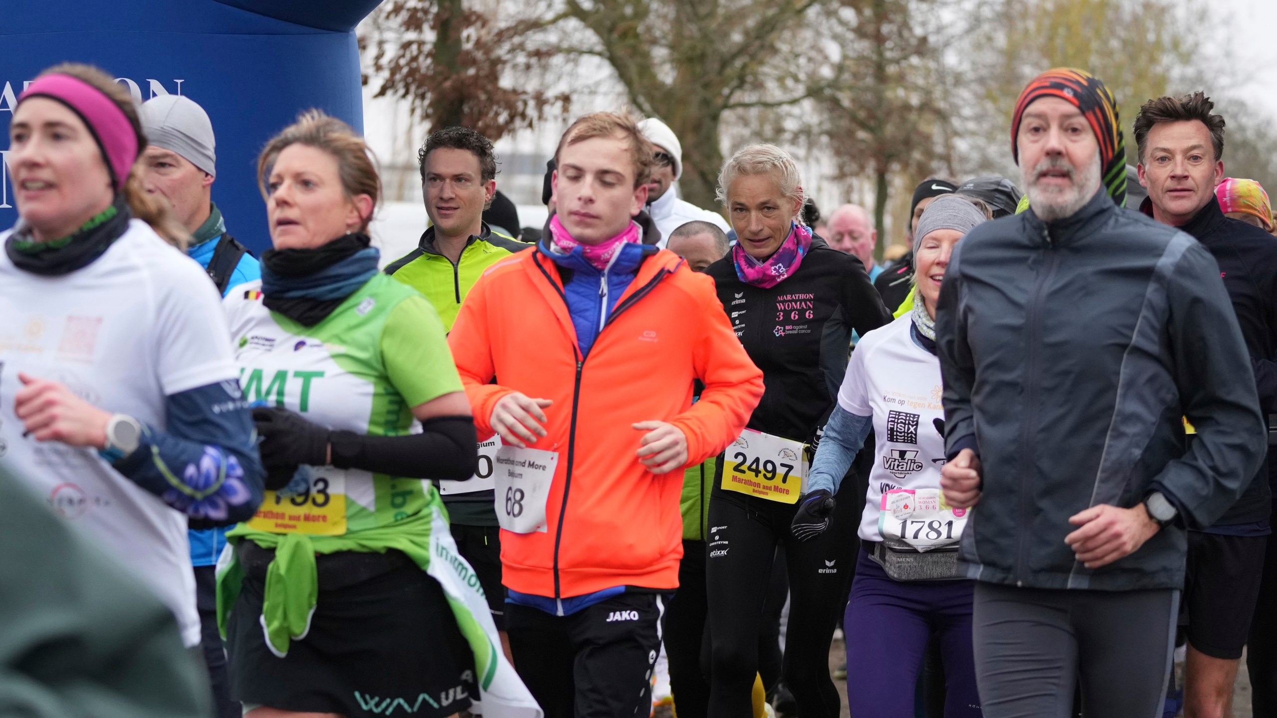 Belgian ultra runner Hilde Dosogne, center, runs with the pack during her 366th consecutive marathon in Ghent, Belgium, Tuesday, Dec. 31, 2024. (AP Photo/Virginia Mayo)