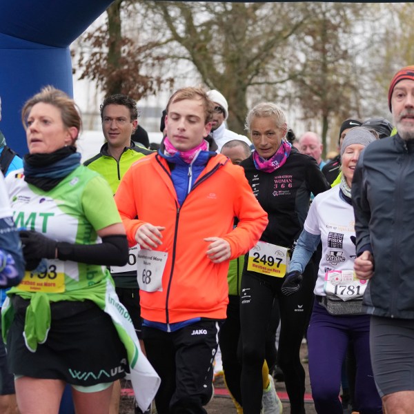 Belgian ultra runner Hilde Dosogne, center, runs with the pack during her 366th consecutive marathon in Ghent, Belgium, Tuesday, Dec. 31, 2024. (AP Photo/Virginia Mayo)