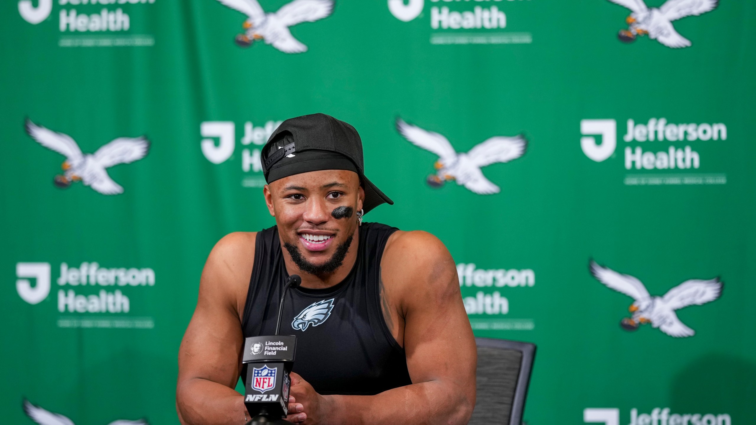 Philadelphia Eagles running back Saquon Barkley talks to reporters following an NFL football game against the Dallas Cowboys, Sunday, Dec. 29, 2024, in Philadelphia. The Eagles won 41-7. (AP Photo/Matt Slocum)