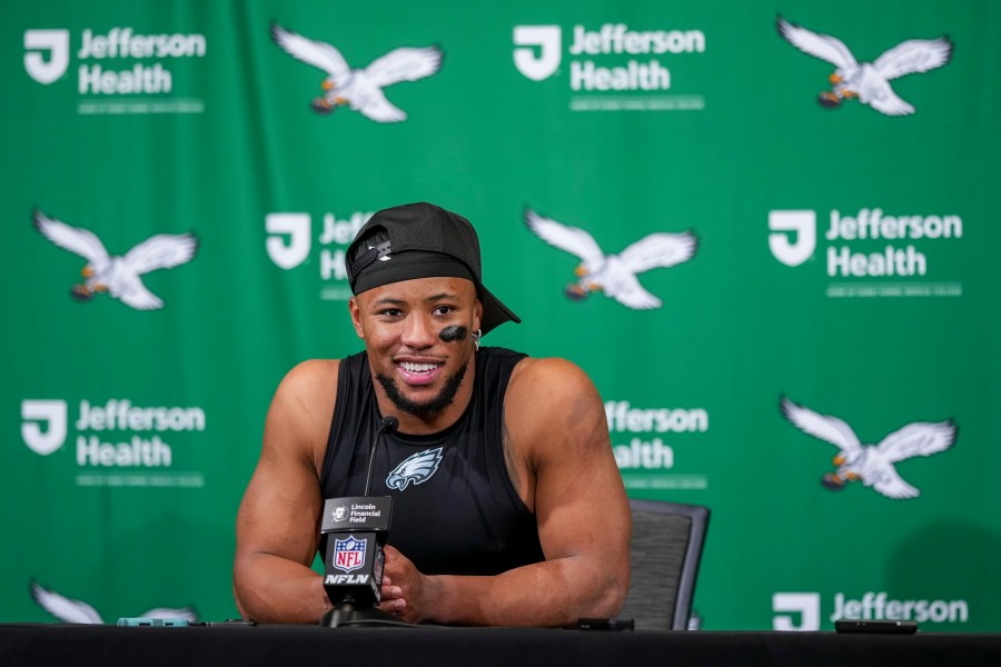 Philadelphia Eagles running back Saquon Barkley talks to reporters following an NFL football game against the Dallas Cowboys, Sunday, Dec. 29, 2024, in Philadelphia. The Eagles won 41-7. (AP Photo/Matt Slocum)