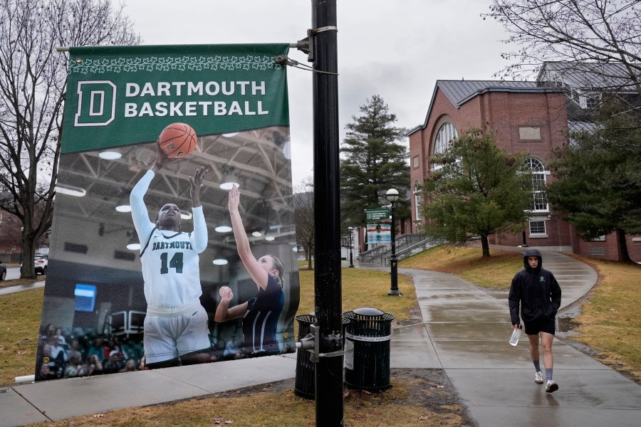 FILE - A student walks near the Alumni Gymnasium on the campus of Dartmouth College, March 5, 2024, in Hanover, N.H. (AP Photo/Robert F. Bukaty, File)