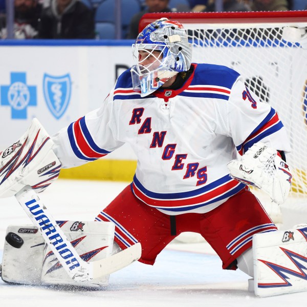 New York Rangers goaltender Igor Shesterkin (31) makes a pad save during the first period of an NHL hockey game against the Buffalo Sabres Wednesday, Dec. 11, 2024, in Buffalo, N.Y. (AP Photo/Jeffrey T. Barnes)