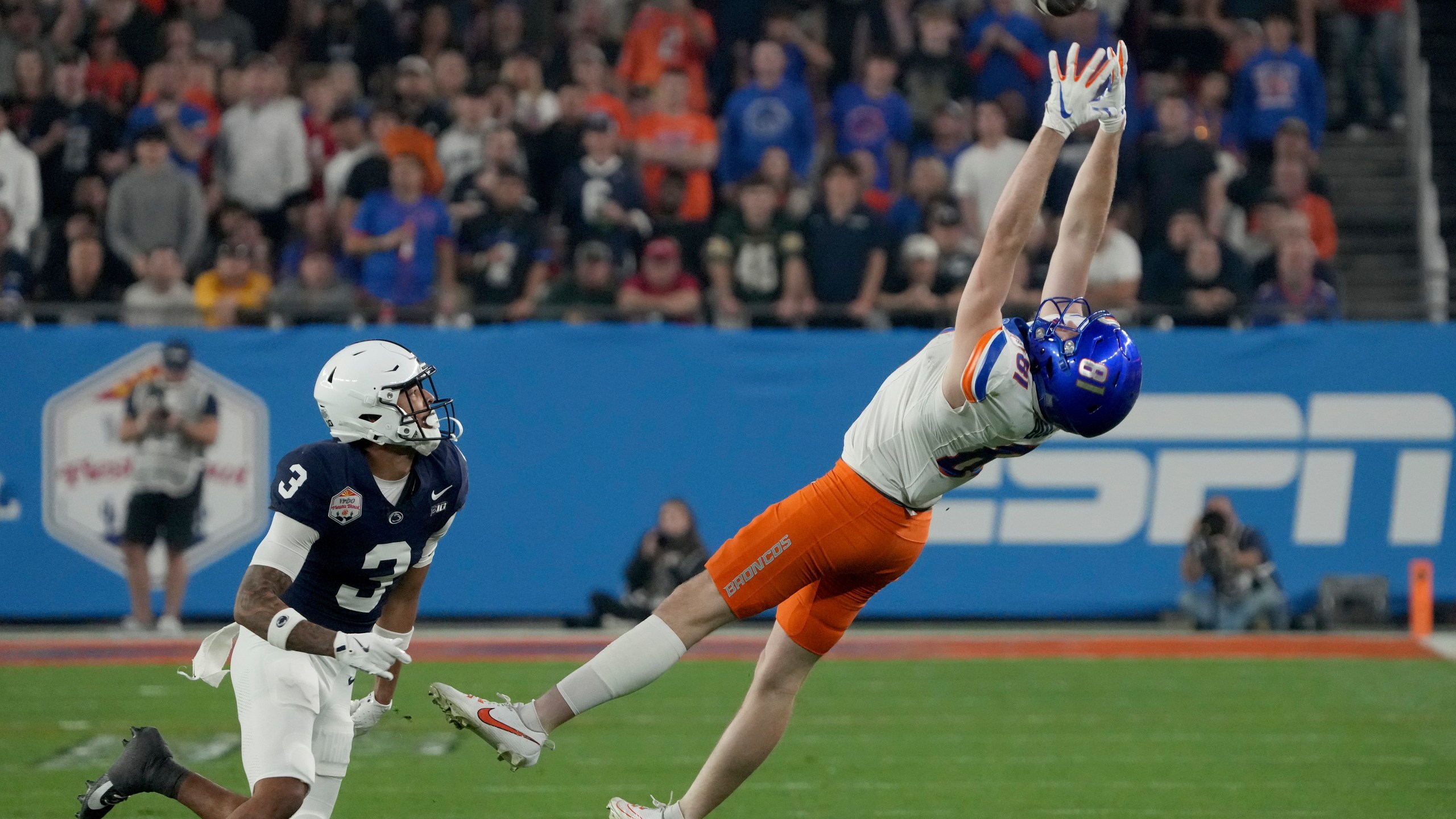 Boise State wide receiver Austin Bolt (81) can't make the catch as Penn State cornerback Jalen Kimber (3) defends during the first half of the Fiesta Bowl NCAA college football CFP quarterfinal game, Tuesday, Dec. 31, 2024, in Glendale, Ariz. (AP Photo/Rick Scuteri)