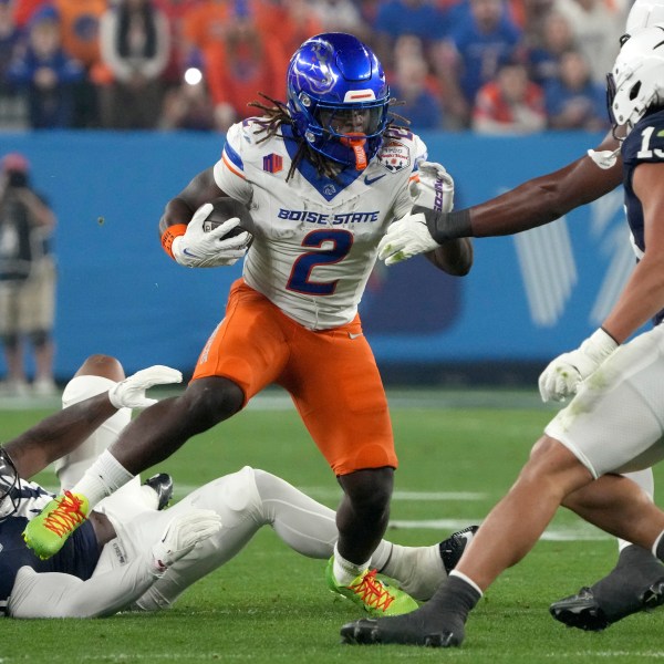 Boise State running back Ashton Jeanty (2) runs the ball against Penn State during the first half of the Fiesta Bowl NCAA college football CFP quarterfinal game, Tuesday, Dec. 31, 2024, in Glendale, Ariz. (AP Photo/Rick Scuteri)