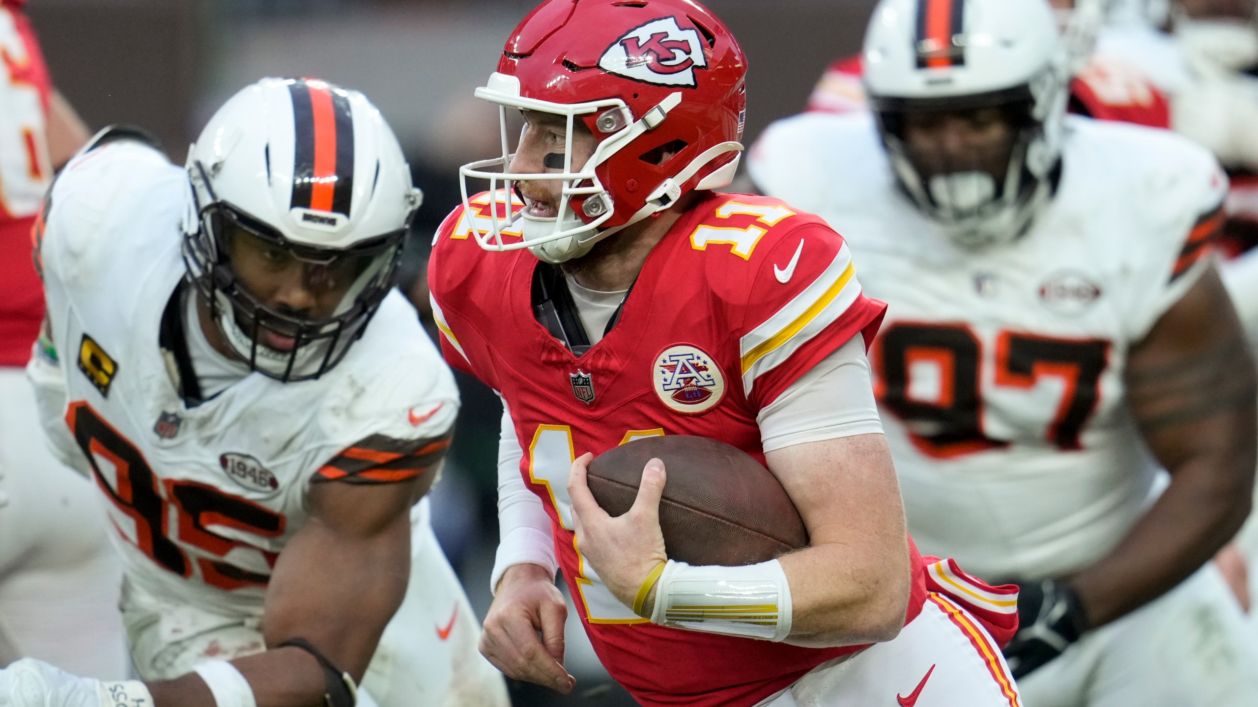 Kansas City Chiefs quarterback Carson Wentz (11) runs against the Cleveland Browns during the second half of an NFL football game, Sunday, Dec. 15, 2024, in Cleveland. (AP Photo/Sue Ogrocki)