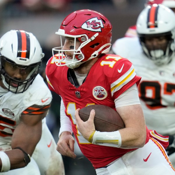 Kansas City Chiefs quarterback Carson Wentz (11) runs against the Cleveland Browns during the second half of an NFL football game, Sunday, Dec. 15, 2024, in Cleveland. (AP Photo/Sue Ogrocki)