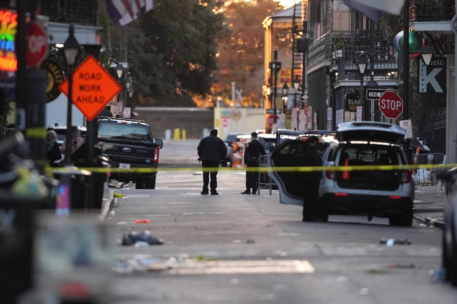 Emergency services attend the scene after a vehicle drove into a crowd on New Orleans' Canal and Bourbon Street, Wednesday Jan. 1, 2025. (AP Photo/Gerald Herbert)