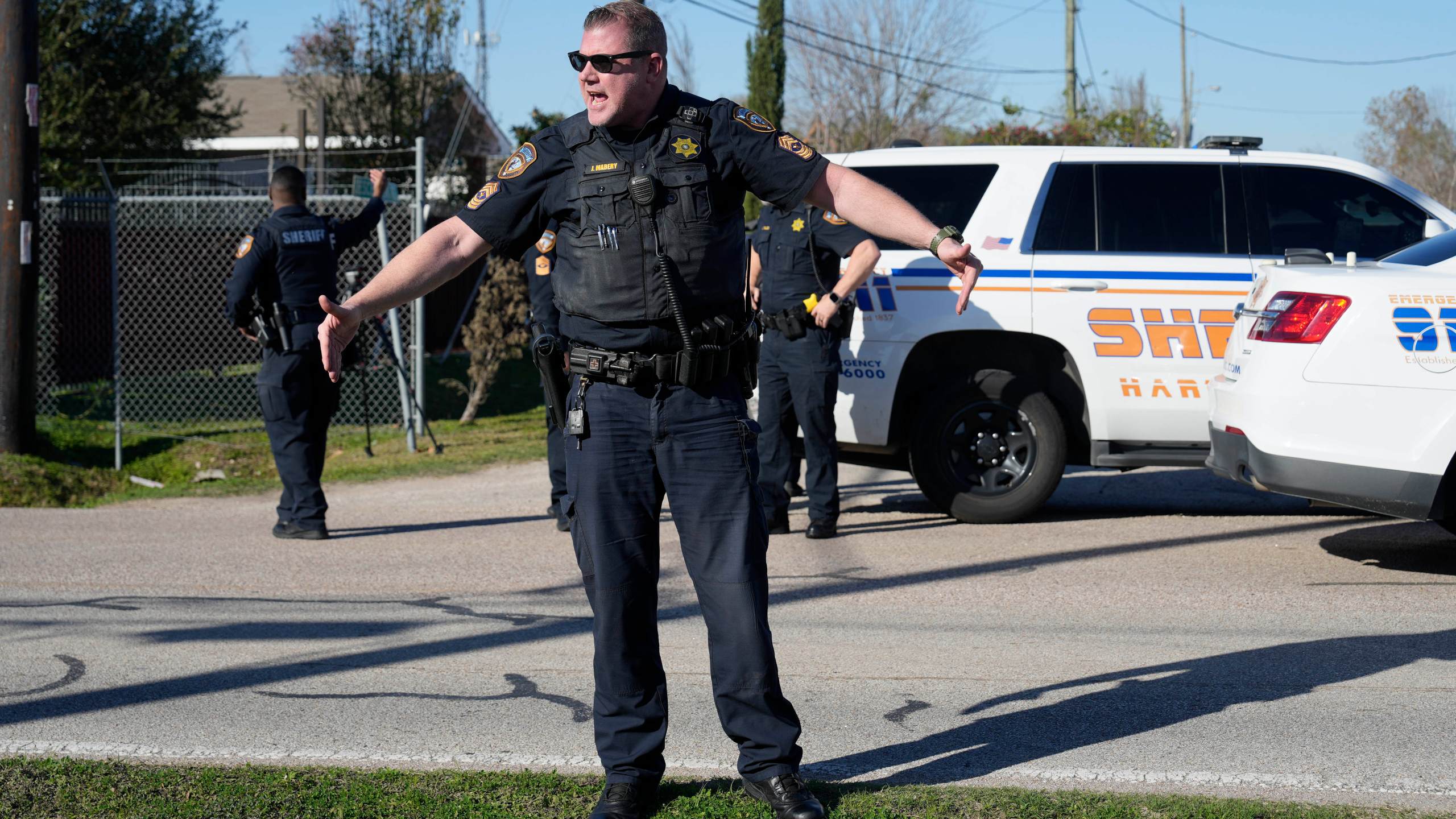 Harris County Sheriff's officers clear the media from the neighborhood where 42-year-old suspect Shamsud-Din Bahar Jabbar is believed to have lived, Wednesday, Jan. 1, 2025, in Houston, after a pickup truck rammed into a crowd of New Orleans revelers on Bourbon Street early on New Year's Day. (AP Photo/David J. Phillip)