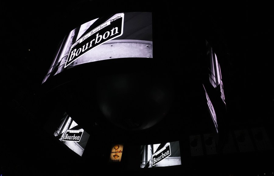 Signage for Bourbon Street is displayed on the scoreboard at the Kaseya Center as a tribute for people killed after a vehicle drove into a crowd in New Orleans before an NBA basketball game between the Miami Heat and the New Orleans Pelicans, Wednesday, Jan. 1, 2025, in Miami. (AP Photo/Lynne Sladky)