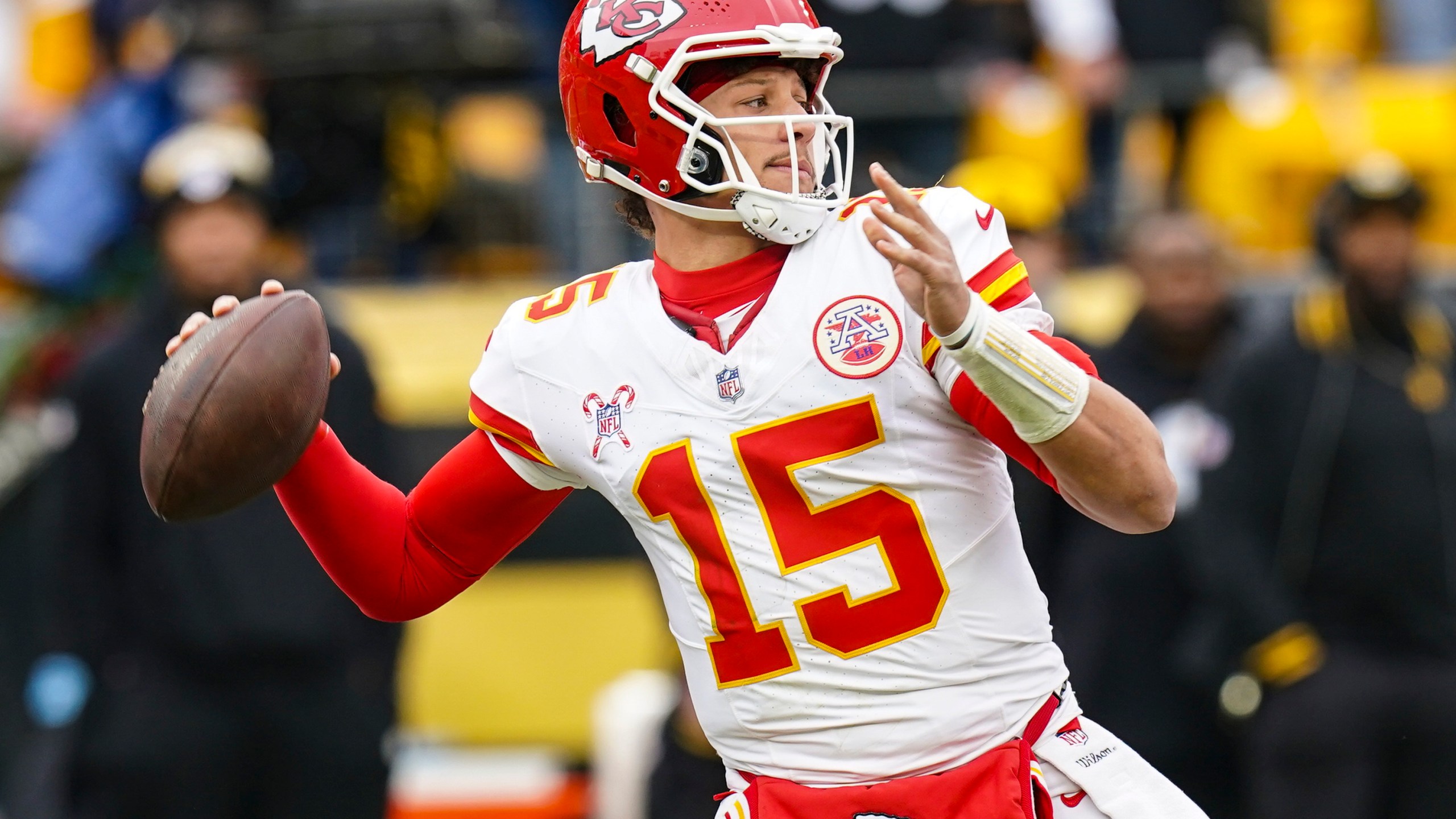 Kansas City Chiefs quarterback Patrick Mahomes (15) passes against the Pittsburgh Steelers during the first half of an NFL football game, Wednesday, Dec. 25, 2024, in Pittsburgh. (AP Photo/Matt Freed)