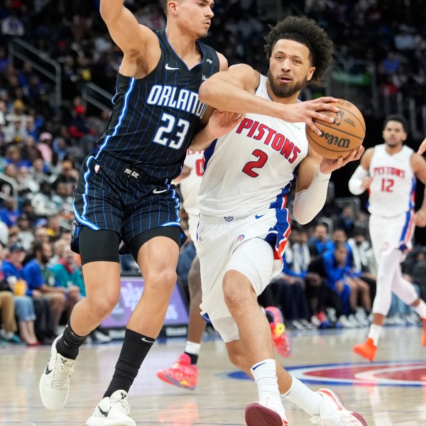 Detroit Pistons guard Cade Cunningham (2) drives as Orlando Magic forward Tristan da Silva (23) defends during the first half of an NBA basketball game, Wednesday, Jan. 1, 2025, in Detroit. (AP Photo/Carlos Osorio)