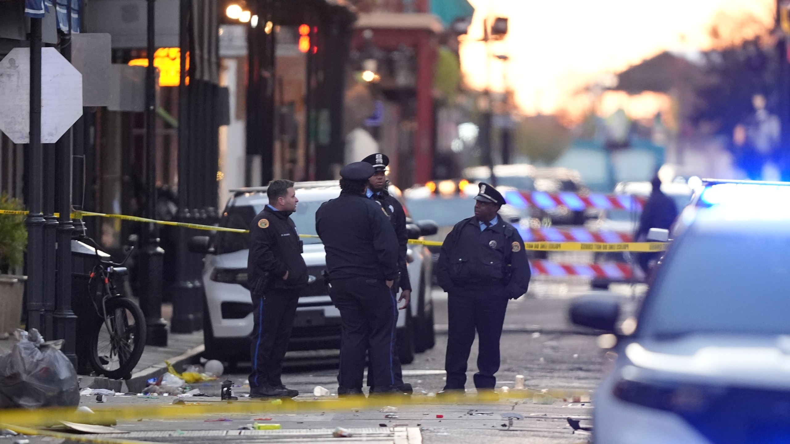 Emergency services attend the scene on Bourbon Street after a vehicle drove into a crowd on New Orleans' Canal and Bourbon Street, Wednesday Jan. 1, 2025. (AP Photo/Gerald Herbert)