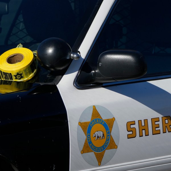 FILE - A roll of police tape is left on the windshield of a Los Angeles County sheriff's vehicle in the parking lot of its training academy in Whittier, Calif., Nov. 16, 2022. (AP Photo/Jae C. Hong, File)