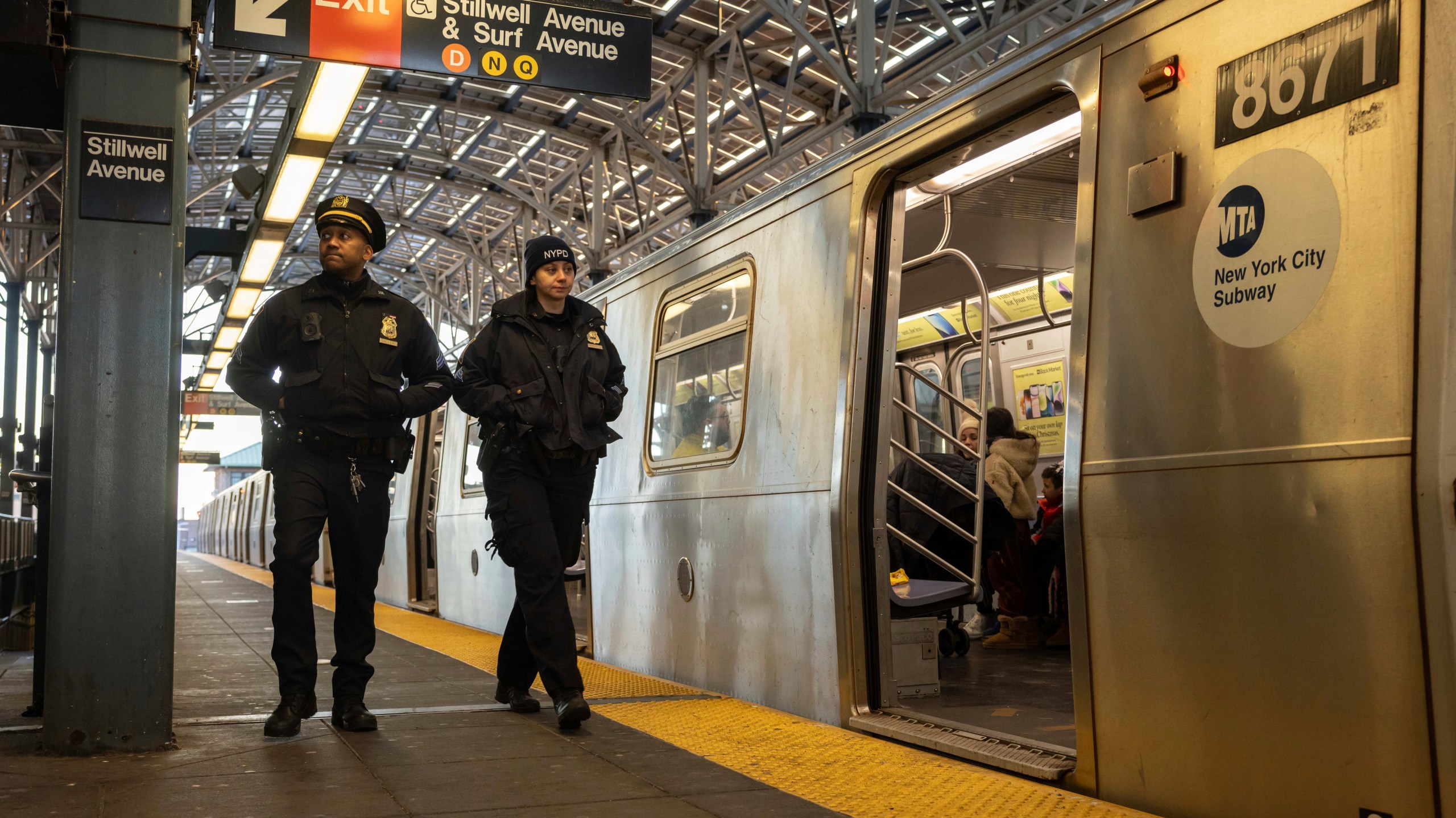 Police officers patrol the F train platform at the Coney Island-Stillwell Avenue Station, Thursday, Dec. 26, 2024, in New York. (AP Photo/Yuki Iwamura)