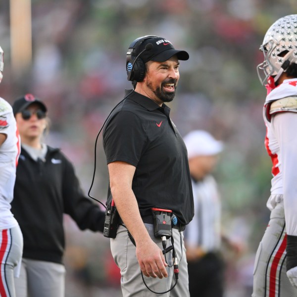 Ohio State head coach Ryan Day smiles during the first half in the quarterfinals of the Rose Bowl College Football Playoff against Oregon, Wednesday, Jan. 1, 2025, in Pasadena, Calif. (AP Photo/Kyusung Gong)