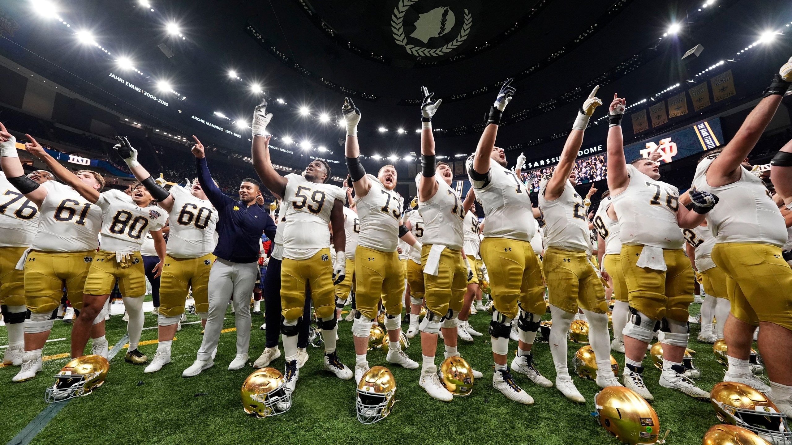 Notre Dame players celebrate after quarterfinal game against Georgia in a College Football Playoff, Thursday, Jan. 2, 2025, in New Orleans. (AP Photo/Gerald Herbert)