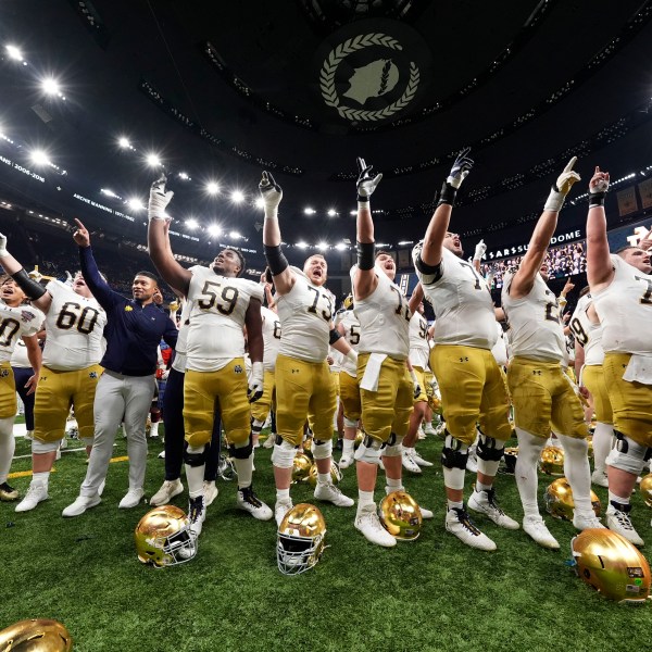 Notre Dame players celebrate after quarterfinal game against Georgia in a College Football Playoff, Thursday, Jan. 2, 2025, in New Orleans. (AP Photo/Gerald Herbert)