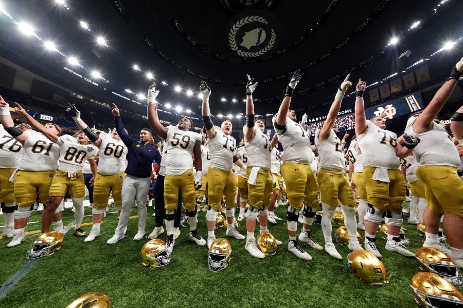 Notre Dame players celebrate after quarterfinal game against Georgia in a College Football Playoff, Thursday, Jan. 2, 2025, in New Orleans. (AP Photo/Gerald Herbert)