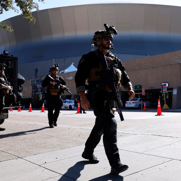 Local SWAT teams patrol outside the Caesars Superdome ahead of the Sugar Bowl NCAA College Football Playoff game, Thursday, Jan. 2, 2025, in New Orleans. (AP Photo/Butch Dill)