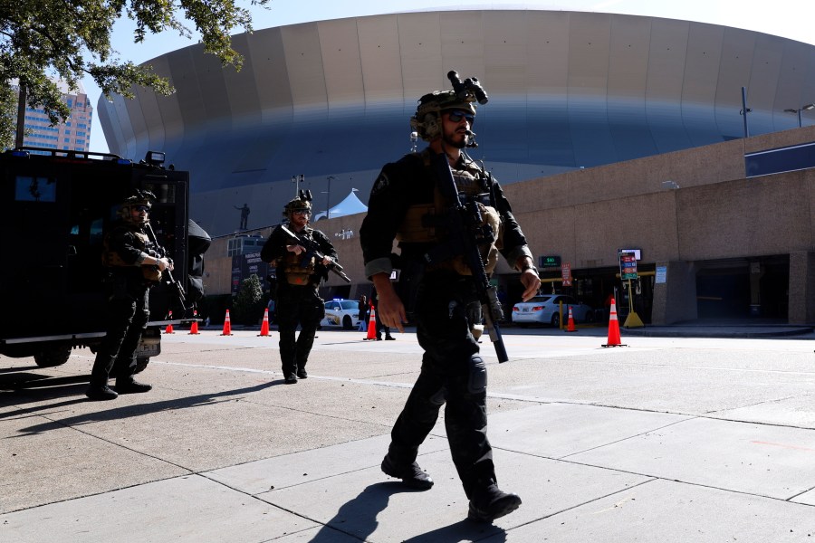 Local SWAT teams patrol outside the Caesars Superdome ahead of the Sugar Bowl NCAA College Football Playoff game, Thursday, Jan. 2, 2025, in New Orleans. (AP Photo/Butch Dill)