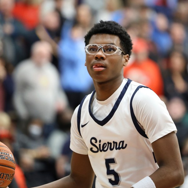 FILE - Sierra Canyon's Bryce James #5 warms up against Christopher Columbus at halftime during a high school basketball game at the Hoophall Classic, on January 16, 2023, in Springfield, MA. (AP Photo/Gregory Payan, File)