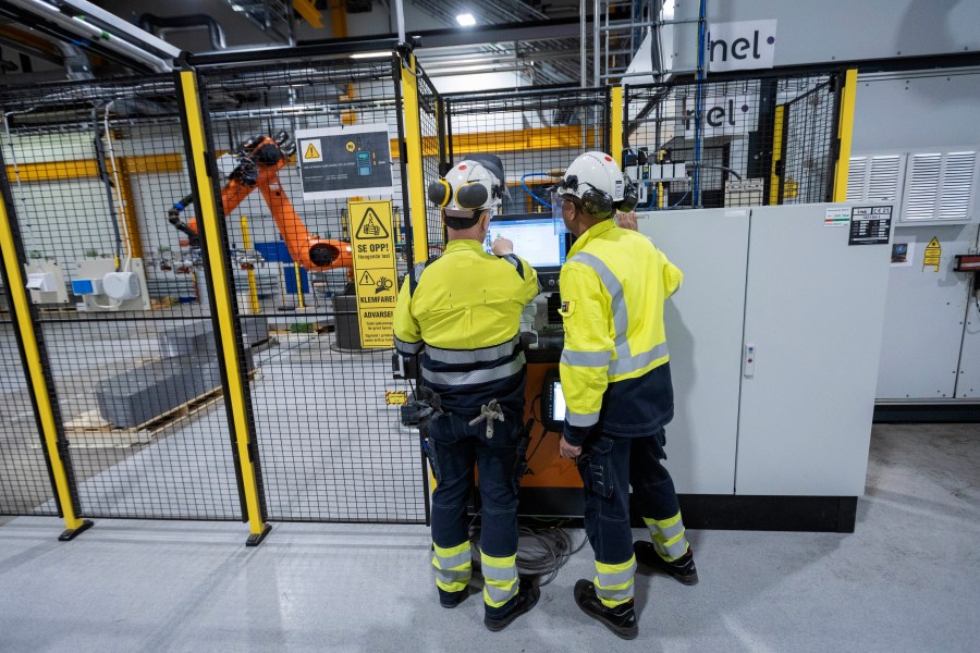 FILE - Employees work at a facility for the Norwegian company Nel in Heroya, Norway, on April 20, 2023. (AP Photo/Trond R. Teigen, File)