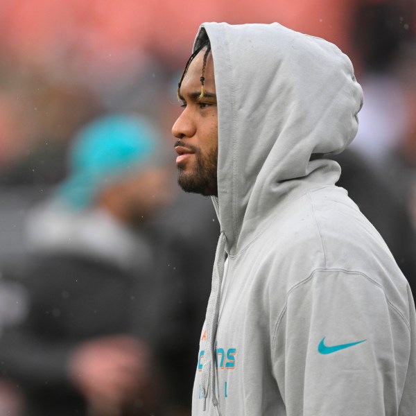 Miami Dolphins quarterback Tua Tagovailoa stands on the field before an NFL football game against the Cleveland Browns Sunday, Dec. 29, 2024, in Cleveland. (AP Photo/David Richard)