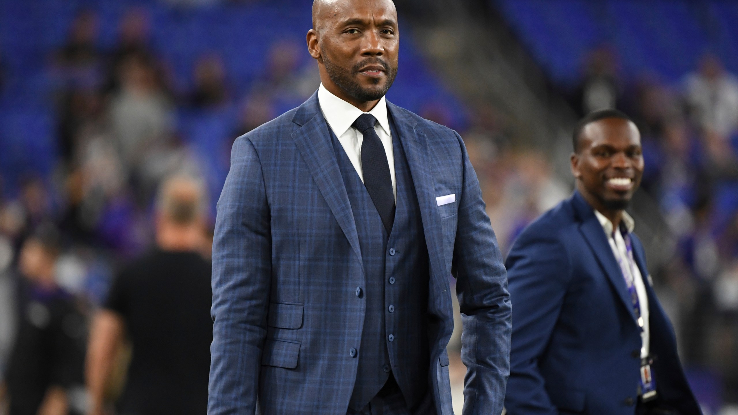 FILE - ESPN's Monday Night Football analyst Louis Riddick walks on the field during pre-game warm-ups before an NFL football game between the Baltimore Ravens and the Indianapolis Colts, on Oct. 11, 2021, in Baltimore, Md. (AP Photo/Terrance Williams, File)