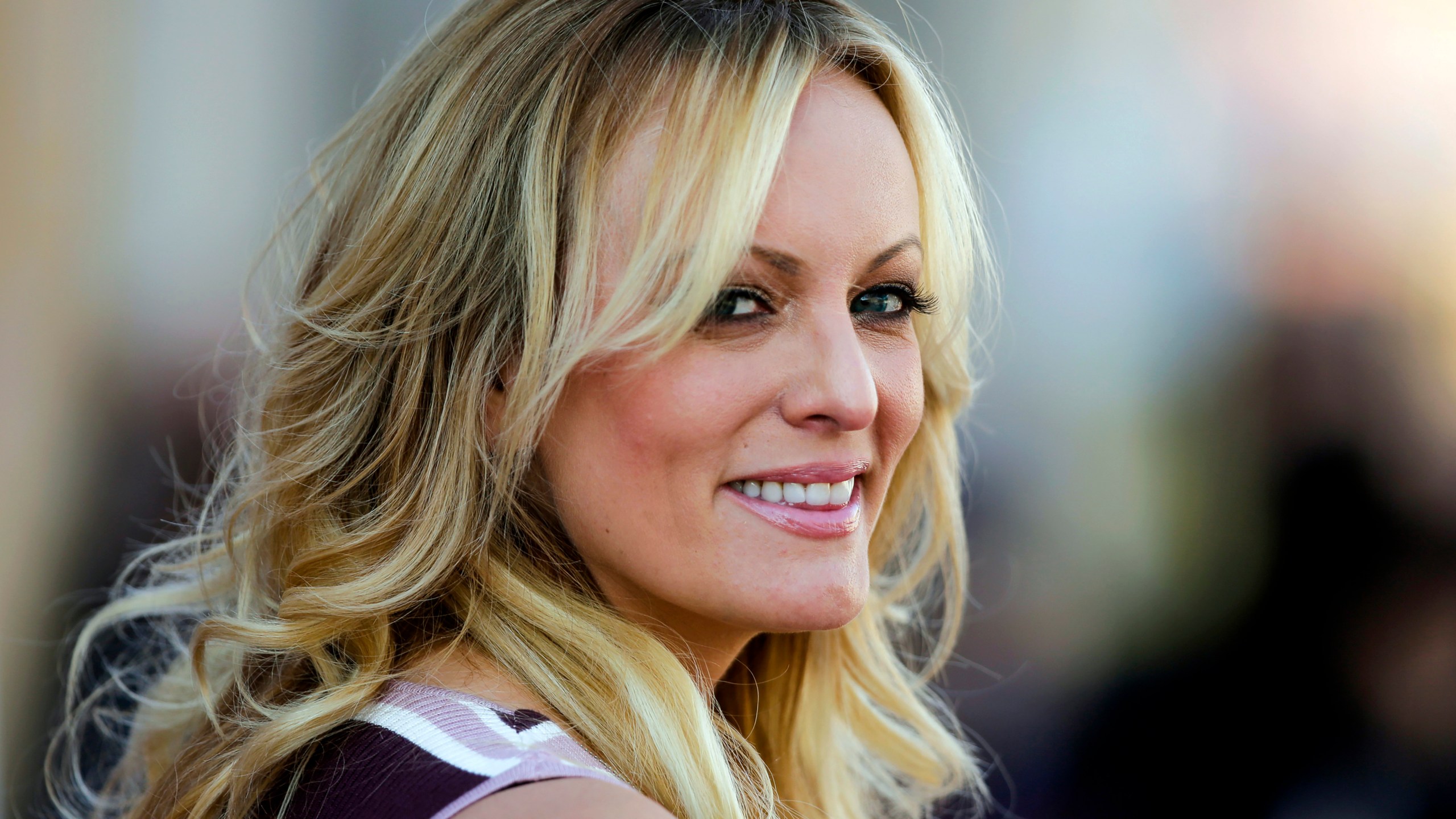 FILE — Adult film actress Stormy Daniels attends the opening of the adult entertainment fair "Venus," in Berlin, Oct. 11, 2018. (AP Photo/Markus Schreiber, File)