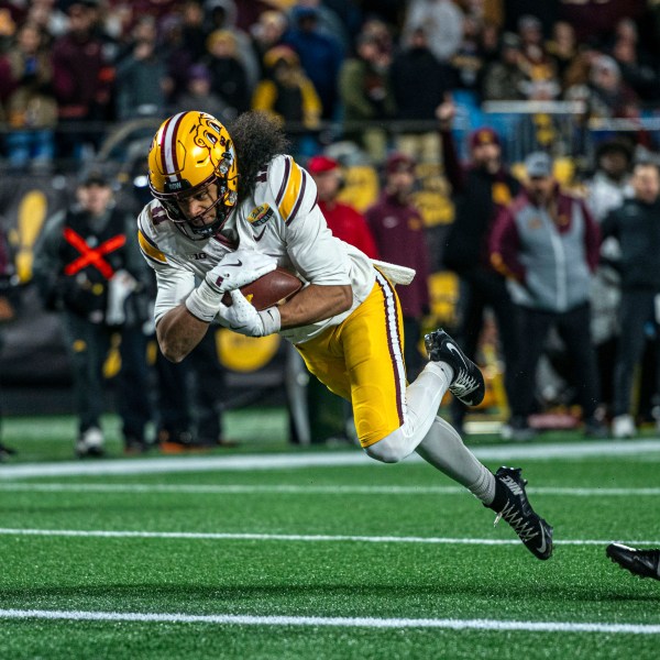 Minnesota wide receiver Elijah Spencer (11) dives in for a touchdown during the first half of the Duke's Mayo Bowl NCAA college football game Friday, Jan. 3, 2025, in Charlotte, N.C. (AP Photo/Robert Simmons)