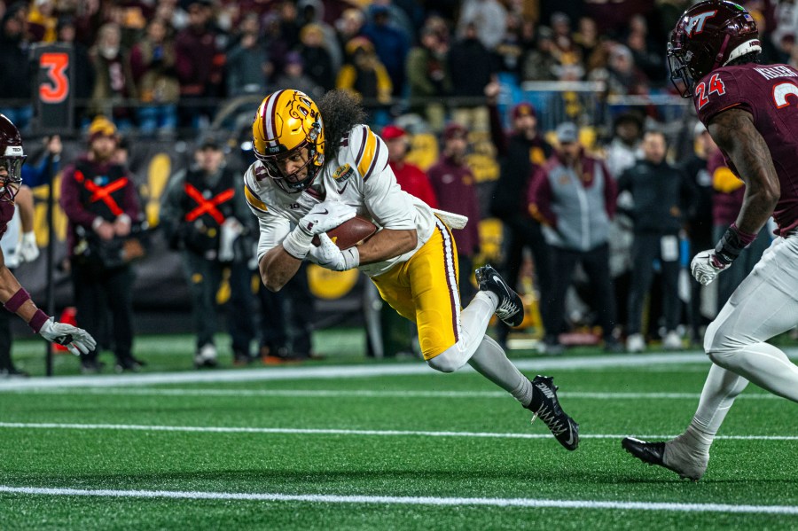 Minnesota wide receiver Elijah Spencer (11) dives in for a touchdown during the first half of the Duke's Mayo Bowl NCAA college football game Friday, Jan. 3, 2025, in Charlotte, N.C. (AP Photo/Robert Simmons)