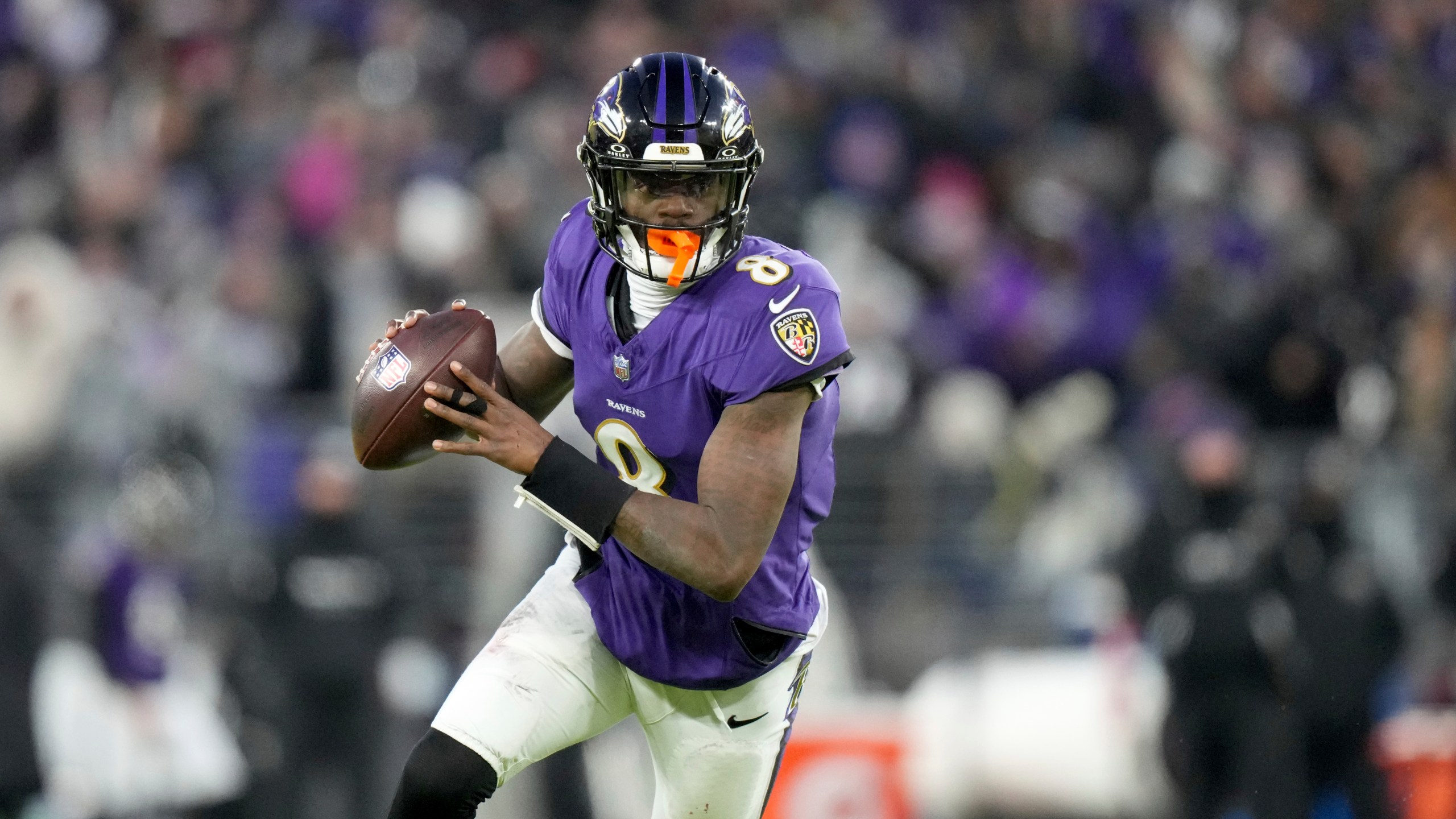 Baltimore Ravens quarterback Lamar Jackson scrambles during the first half of an NFL football game against the Cleveland Browns Saturday, Jan. 4, 2025, in Baltimore. (AP Photo/Stephanie Scarbrough)