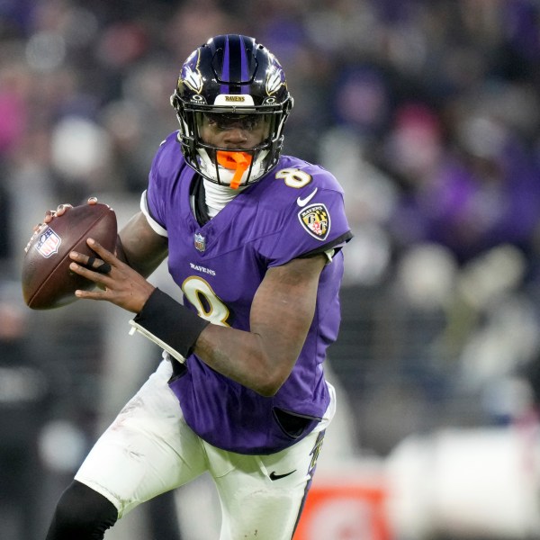 Baltimore Ravens quarterback Lamar Jackson scrambles during the first half of an NFL football game against the Cleveland Browns Saturday, Jan. 4, 2025, in Baltimore. (AP Photo/Stephanie Scarbrough)