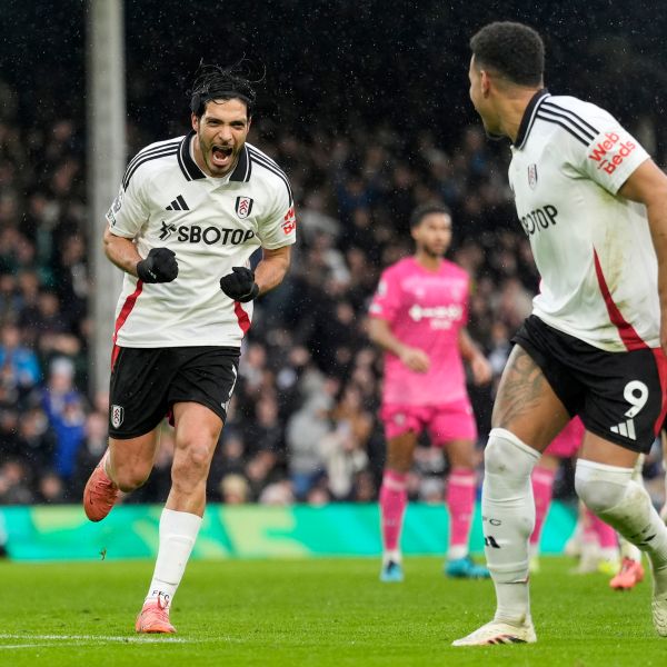 Fulham's Raul Jimenez, left, celebrates after scoring his sides first goal from the penalty spot during the English Premier League soccer match between Fulham and Ipswich Town at Craven Cottage stadium, London, Sunday Jan. 5, 2025. (Andrew Matthews/PA via AP)