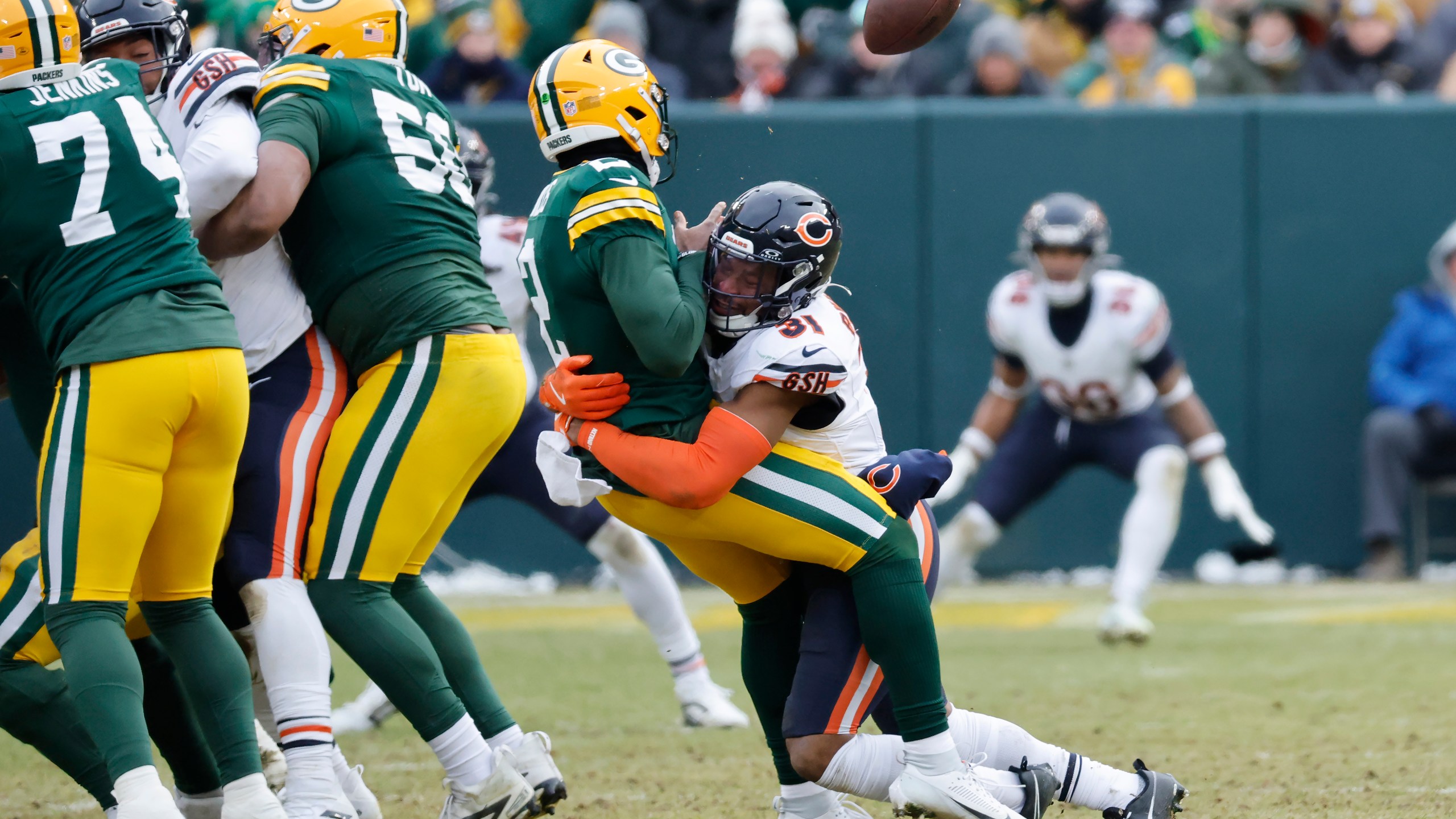 Chicago Bears safety Kevin Byard III (31) forces Green Bay Packers quarterback Malik Willis to fumble the ball, which was recovered by the Bears, during the second half of an NFL football game, Sunday, Jan. 5, 2025, in Green Bay, Wis. (AP Photo/Mike Roemer)