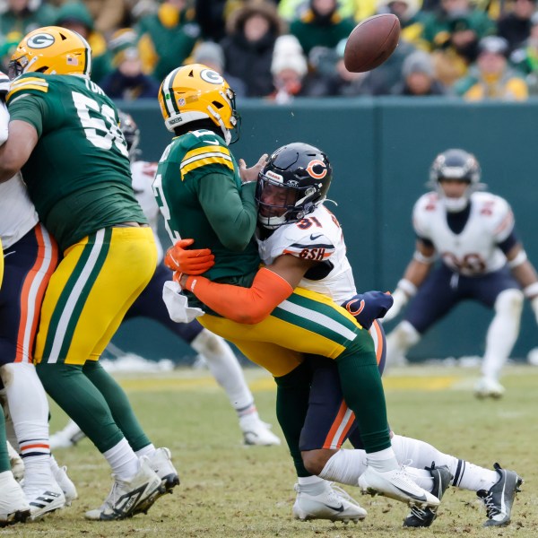 Chicago Bears safety Kevin Byard III (31) forces Green Bay Packers quarterback Malik Willis to fumble the ball, which was recovered by the Bears, during the second half of an NFL football game, Sunday, Jan. 5, 2025, in Green Bay, Wis. (AP Photo/Mike Roemer)