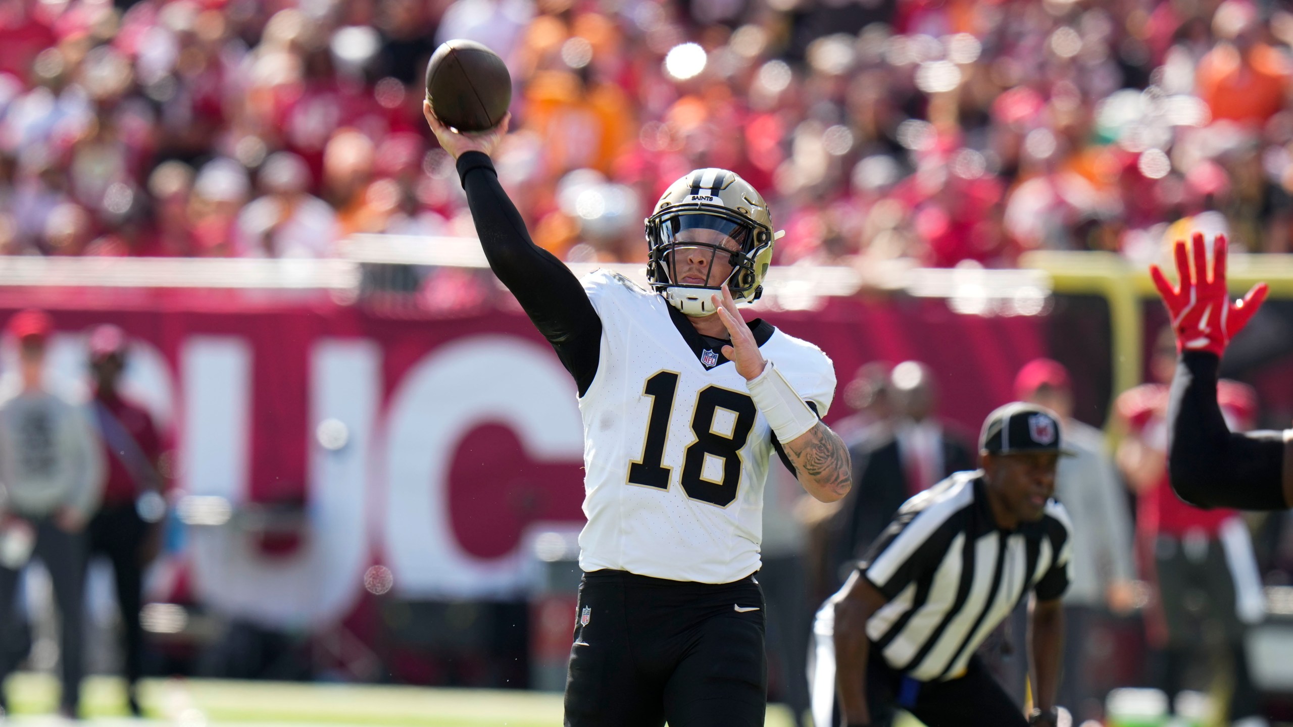 New Orleans Saints quarterback Spencer Rattler (18) passes during the first half of an NFL football game against the Tampa Bay Buccaneers Sunday, Jan. 5, 2025, in Tampa, Fla. (AP Photo/Chris O'Meara)