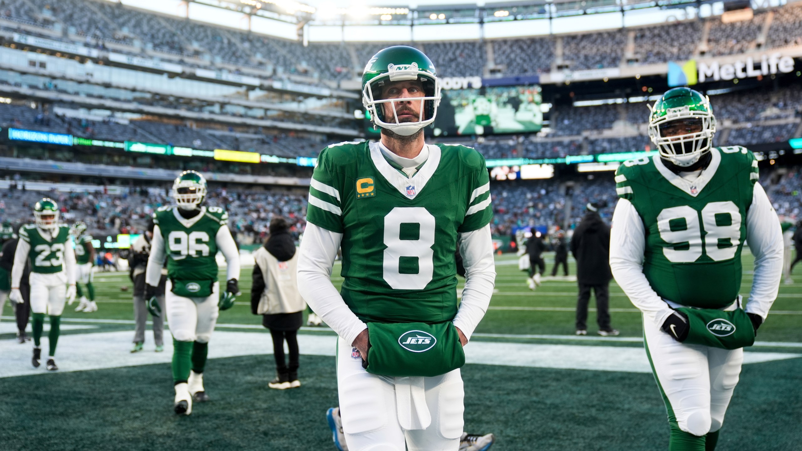 New York Jets quarterback Aaron Rodgers (8) looks on before an NFL football game against the Miami Dolphins, Sunday, Jan. 5, 2025, in East Rutherford, N.J. (AP Photo/Seth Wenig)