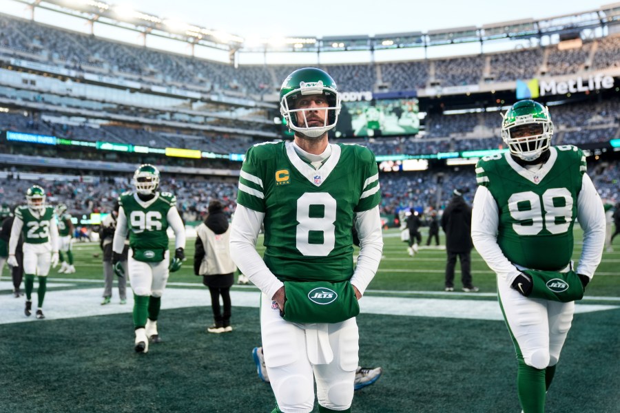 New York Jets quarterback Aaron Rodgers (8) looks on before an NFL football game against the Miami Dolphins, Sunday, Jan. 5, 2025, in East Rutherford, N.J. (AP Photo/Seth Wenig)