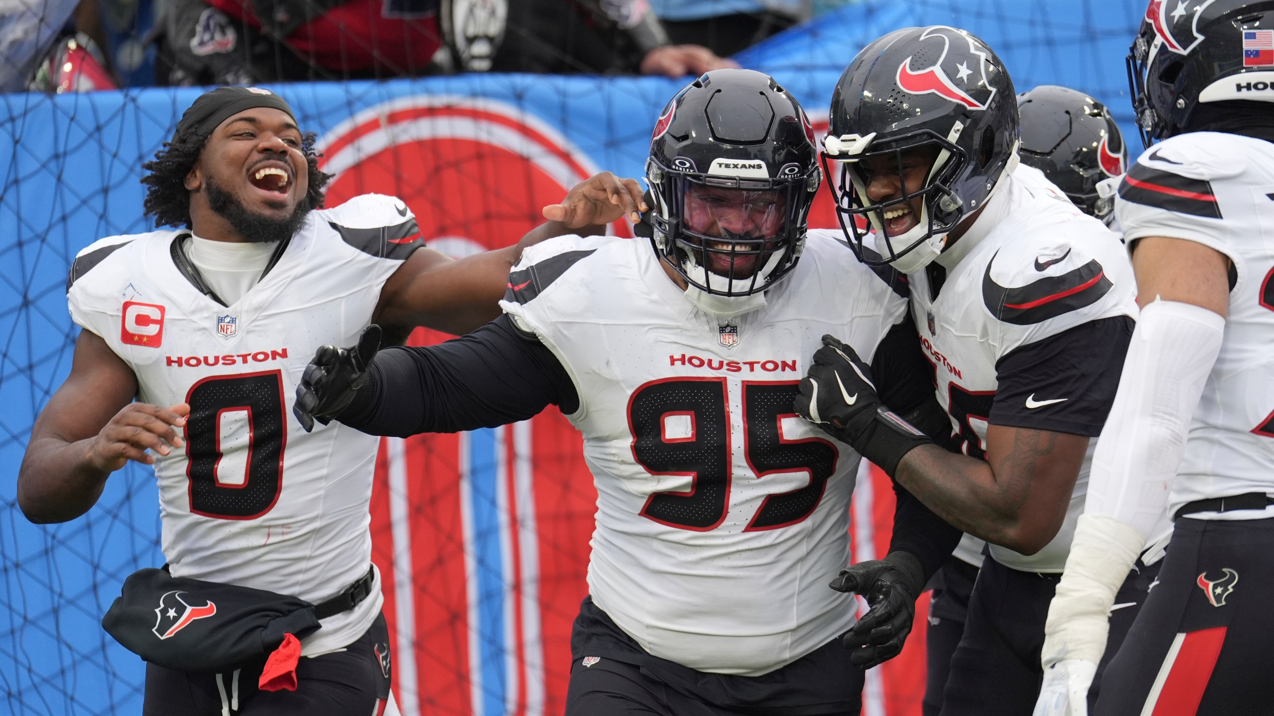 Houston Texans defensive end Derek Barnett (95) celebrates with teammates after returning a fumble for a touchdown against the Tennessee Titans during the second half of an NFL football game Sunday, Jan. 5, 2025, in Nashville, Tenn. (AP Photo/George Walker IV)