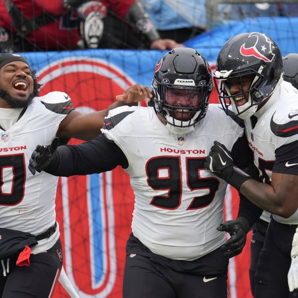 Houston Texans defensive end Derek Barnett (95) celebrates with teammates after returning a fumble for a touchdown against the Tennessee Titans during the second half of an NFL football game Sunday, Jan. 5, 2025, in Nashville, Tenn. (AP Photo/George Walker IV)