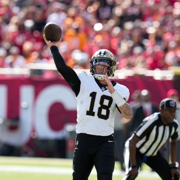 New Orleans Saints quarterback Spencer Rattler (18) passes during the first half of an NFL football game against the Tampa Bay Buccaneers Sunday, Jan. 5, 2025, in Tampa, Fla. (AP Photo/Chris O'Meara)