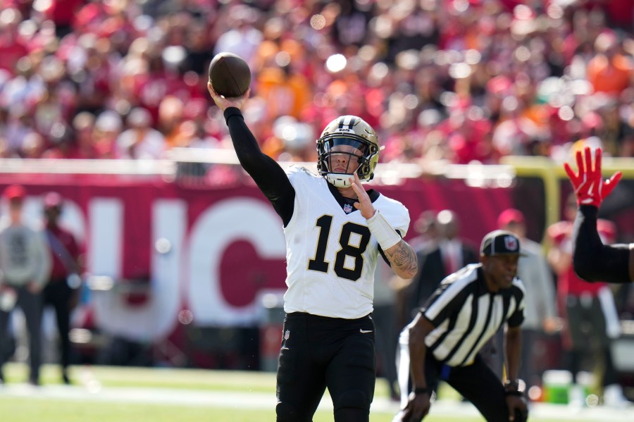 New Orleans Saints quarterback Spencer Rattler (18) passes during the first half of an NFL football game against the Tampa Bay Buccaneers Sunday, Jan. 5, 2025, in Tampa, Fla. (AP Photo/Chris O'Meara)